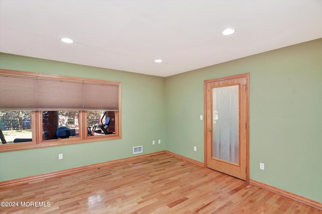 spare room with light hardwood / wood-style floors