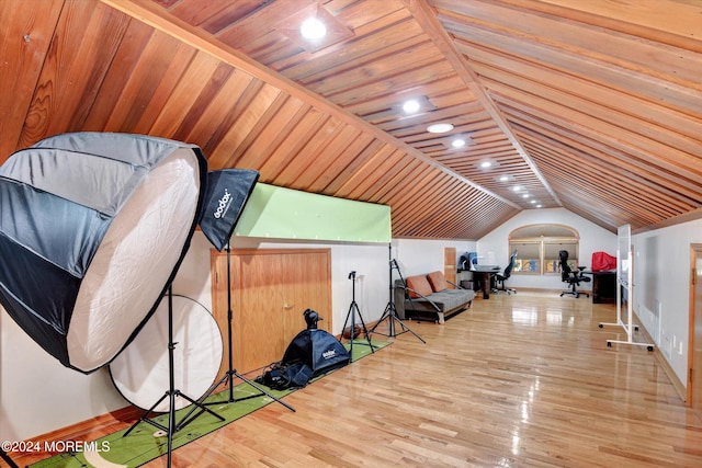 living area with lofted ceiling, hardwood / wood-style floors, and wooden ceiling