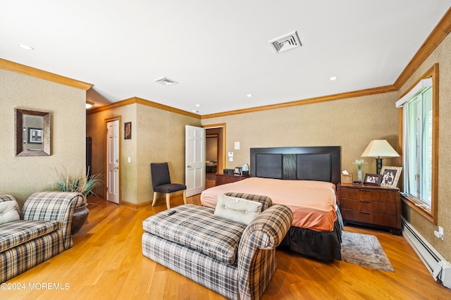 bedroom featuring ornamental molding, light hardwood / wood-style flooring, and a baseboard heating unit