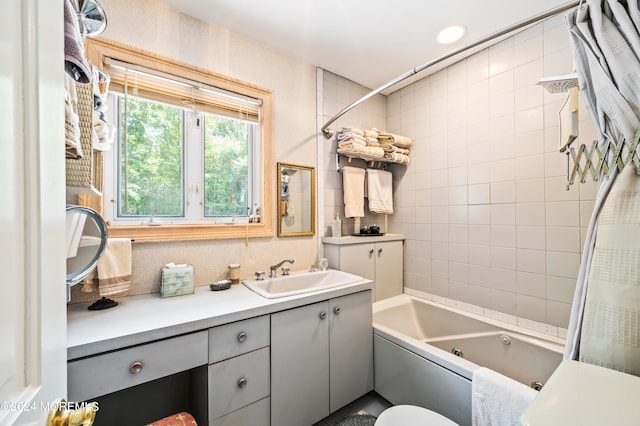 full bathroom featuring vanity, shower / bath combo with shower curtain, and toilet