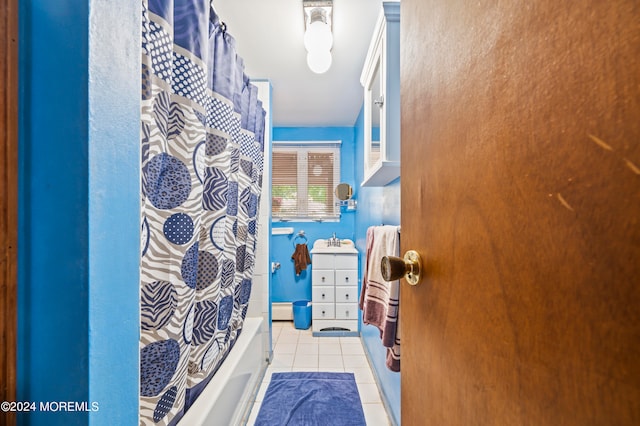 bathroom with vanity, tile patterned floors, and shower / tub combo