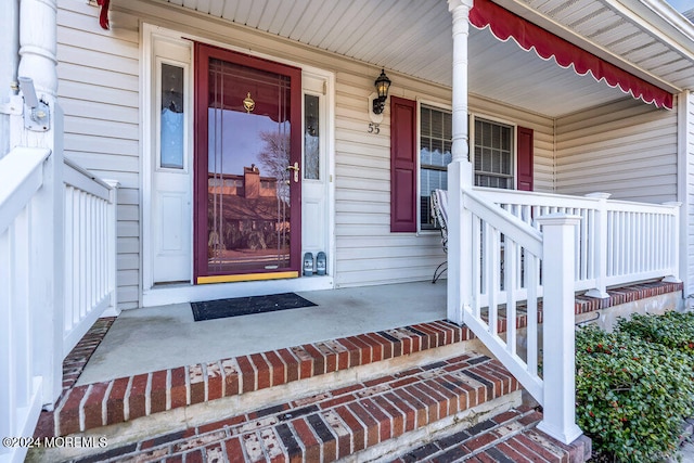 doorway to property featuring a porch