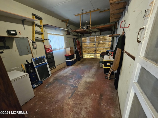 garage with fridge, electric panel, and a garage door opener