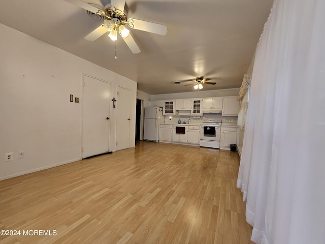 unfurnished living room with baseboards, a ceiling fan, and light wood-style floors