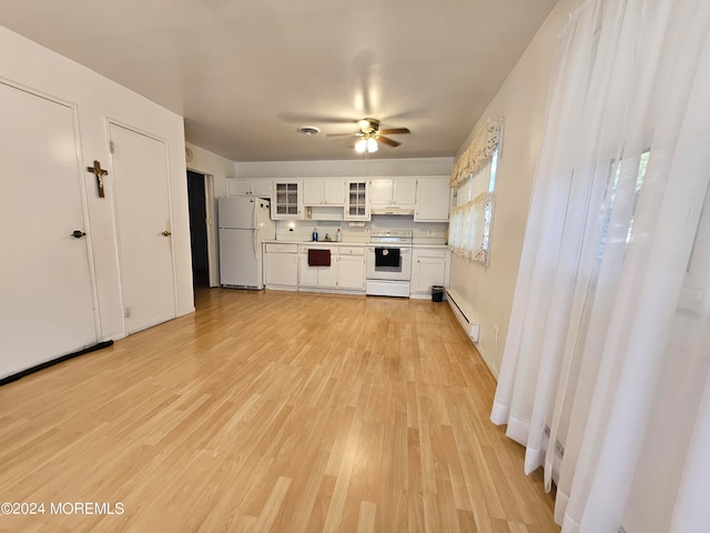 kitchen with white appliances, light hardwood / wood-style floors, white cabinetry, and a baseboard radiator