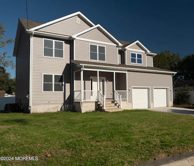 view of front facade featuring a garage, a front lawn, and a porch