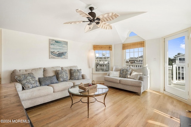 living room with light wood-type flooring and ceiling fan