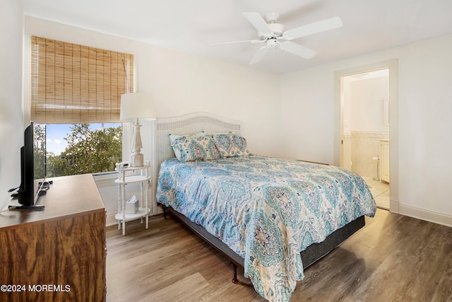 bedroom featuring a closet, hardwood / wood-style floors, and ceiling fan