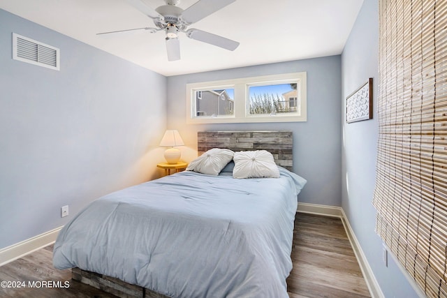 bedroom featuring ceiling fan and hardwood / wood-style floors