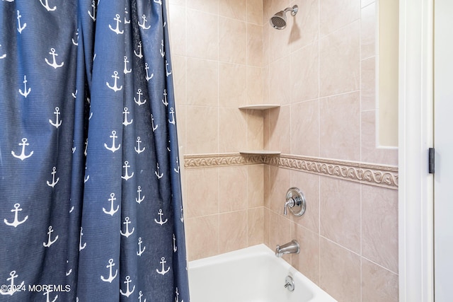 bathroom featuring tile walls and shower / tub combo