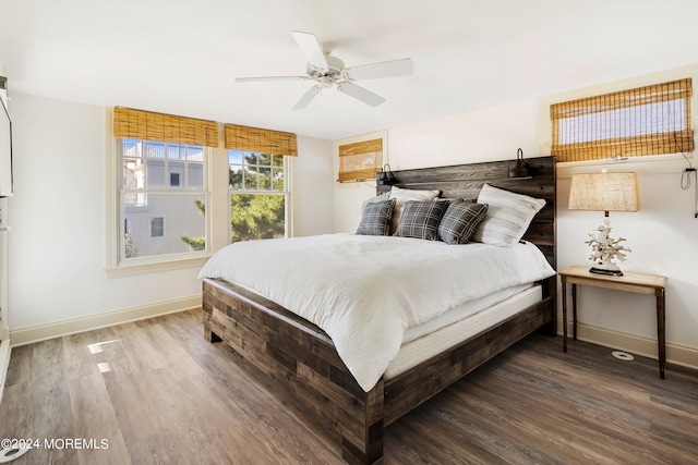 bedroom with hardwood / wood-style floors and ceiling fan