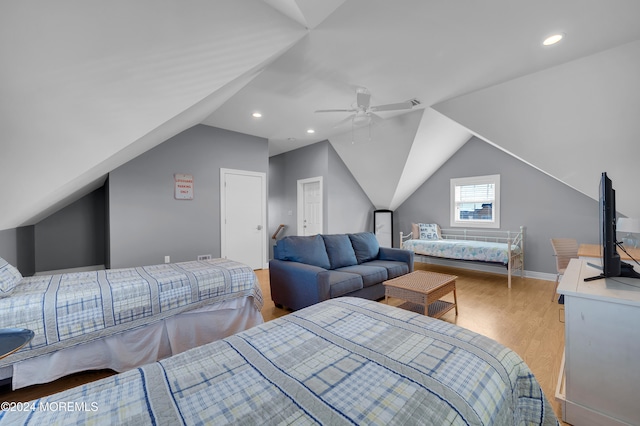 bedroom featuring vaulted ceiling, light hardwood / wood-style floors, and ceiling fan