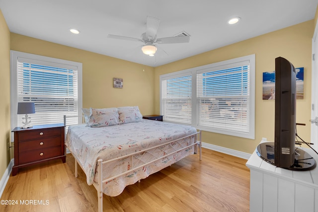 bedroom featuring light hardwood / wood-style flooring and ceiling fan