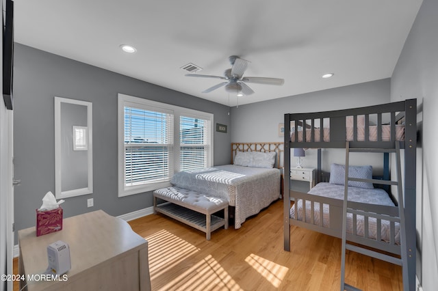 bedroom featuring wood-type flooring and ceiling fan