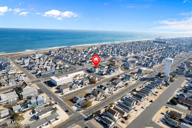 aerial view featuring a water view and a beach view