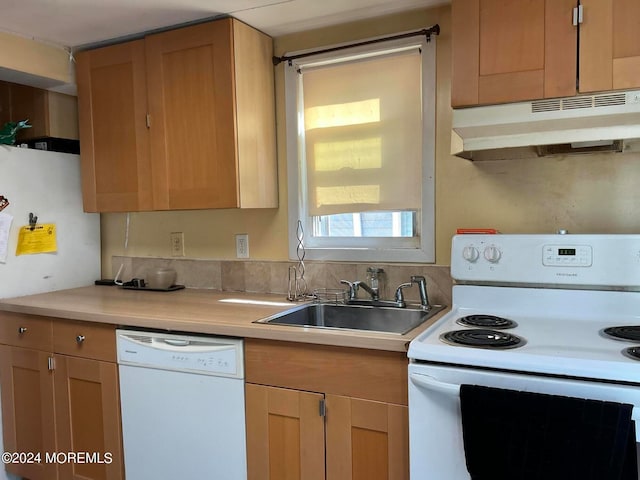 kitchen with sink and white appliances