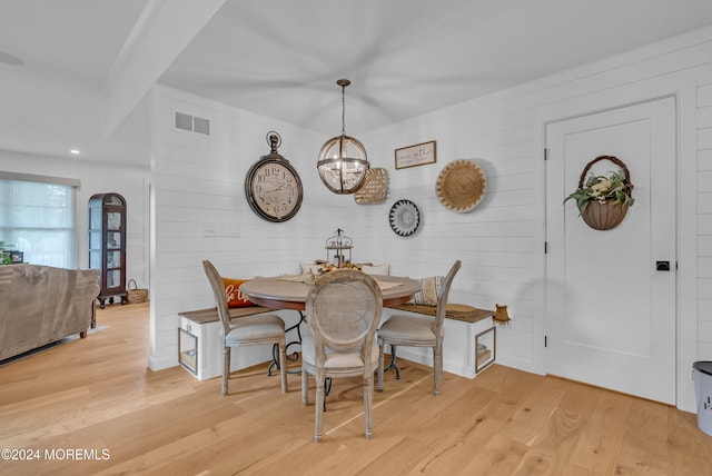 dining room featuring a chandelier and light hardwood / wood-style floors