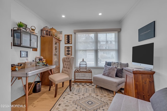 office space with light hardwood / wood-style floors and crown molding