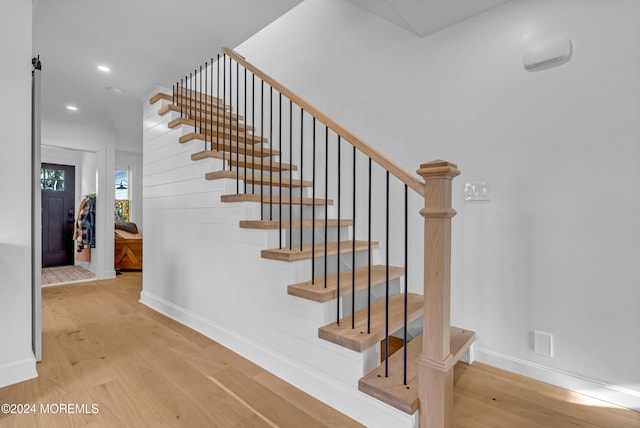 stairway with wood-type flooring