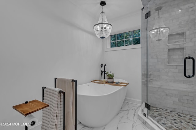 bathroom featuring a chandelier and independent shower and bath