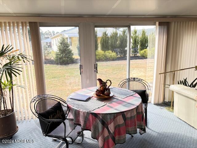 view of carpeted dining area