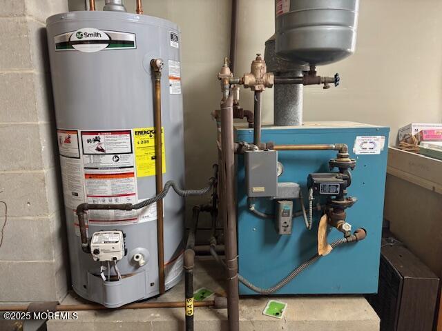 utility room with gas water heater and a heating unit