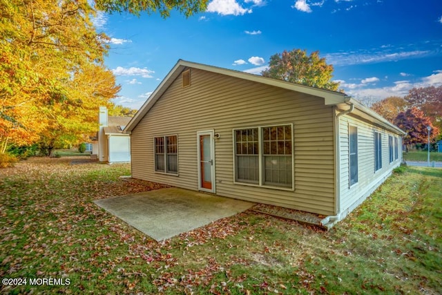 rear view of property with a patio