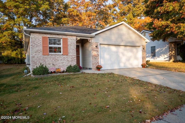 single story home with a front lawn and a garage