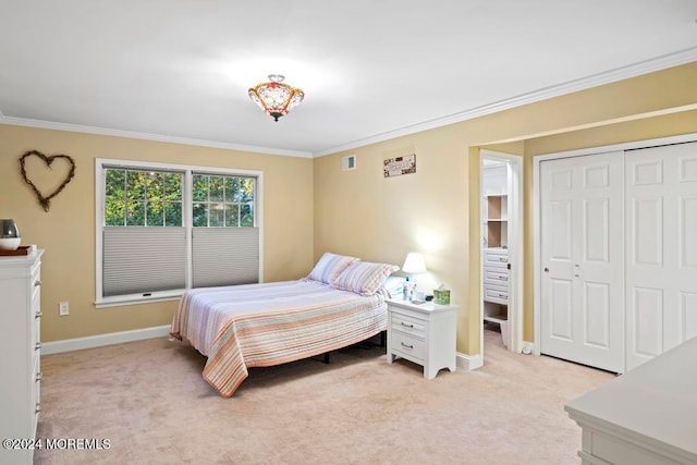 carpeted bedroom with a closet and ornamental molding