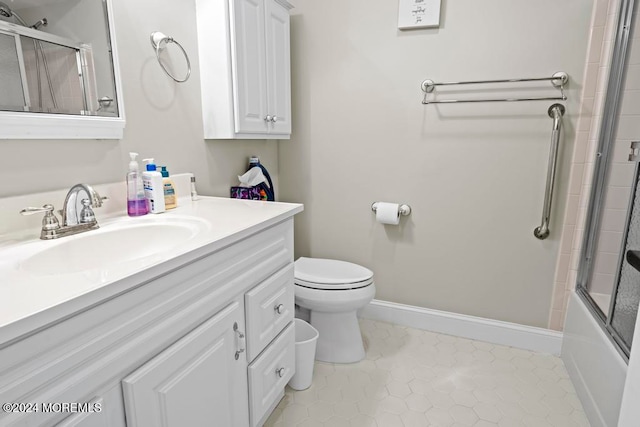 full bathroom featuring vanity, toilet, combined bath / shower with glass door, and tile patterned flooring