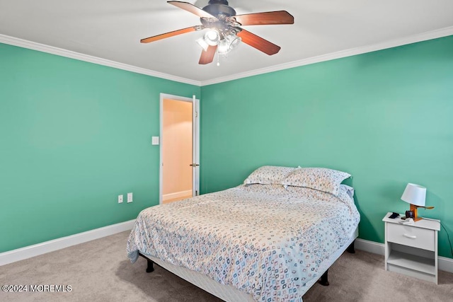 bedroom with carpet, crown molding, and ceiling fan