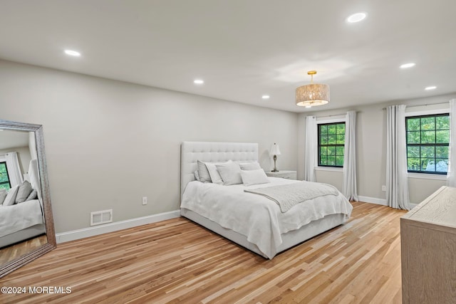 bedroom with light hardwood / wood-style floors