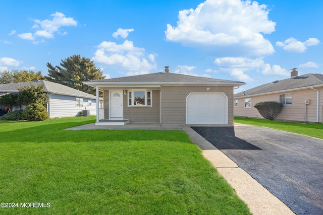 ranch-style house with a front yard and a garage