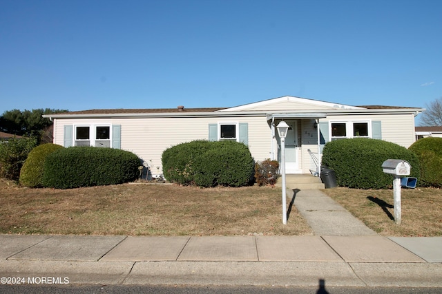 view of front of home with a front yard