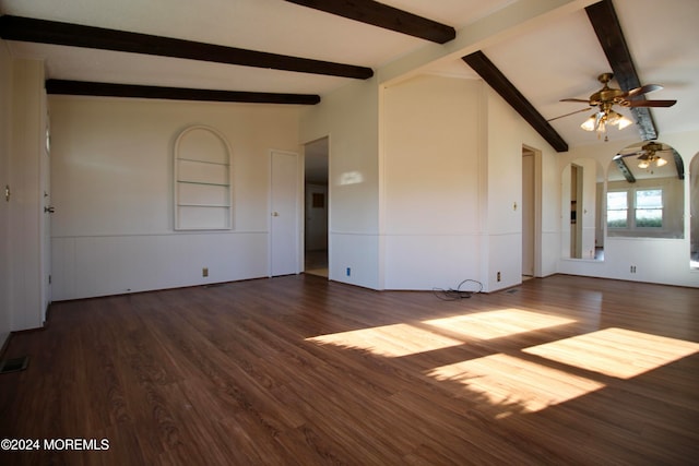 spare room featuring ceiling fan, lofted ceiling with beams, and dark hardwood / wood-style flooring