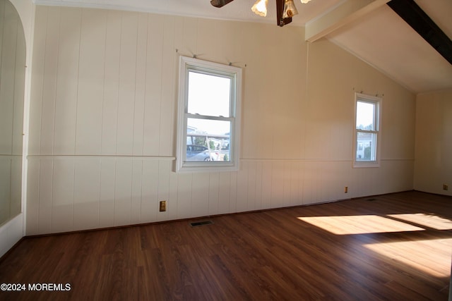 bonus room with a healthy amount of sunlight, lofted ceiling with beams, ceiling fan, and dark hardwood / wood-style flooring