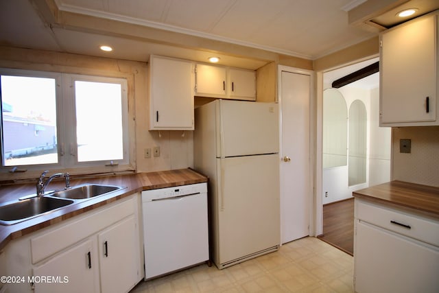 kitchen featuring white cabinetry, wood counters, ornamental molding, sink, and white appliances