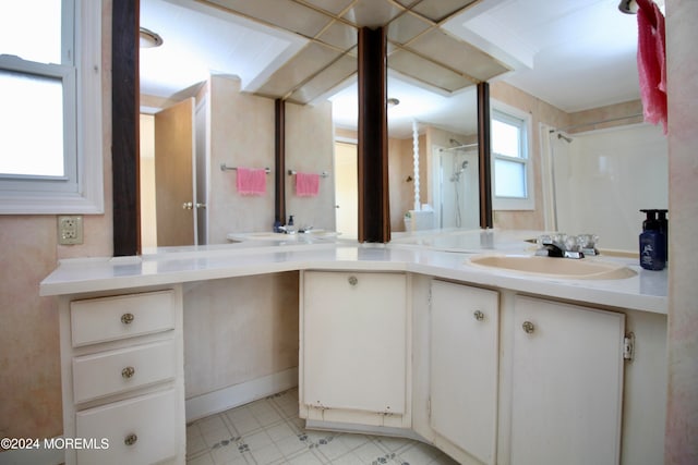 bathroom featuring vanity and a shower