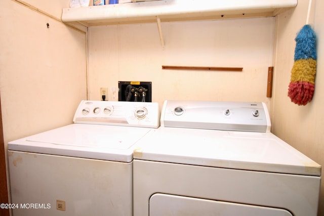 washroom featuring washing machine and dryer