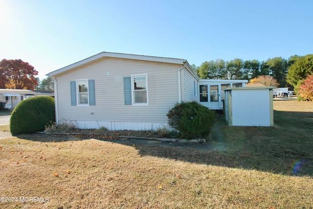 view of home's exterior featuring a yard