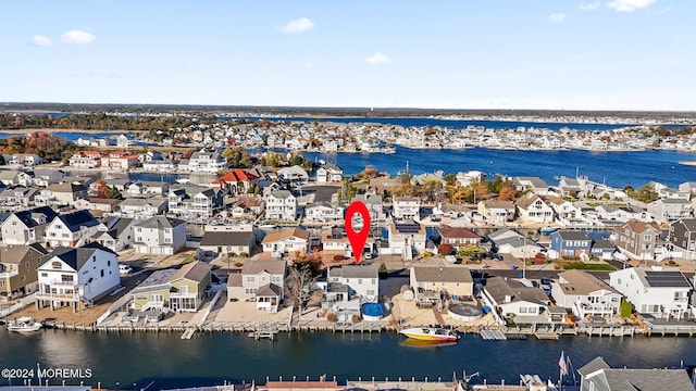 bird's eye view with a residential view and a water view
