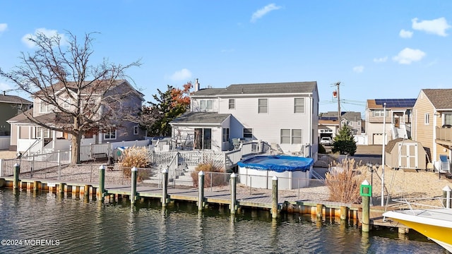 dock area with a deck with water view