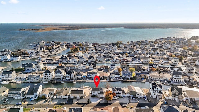 birds eye view of property featuring a water view and a residential view