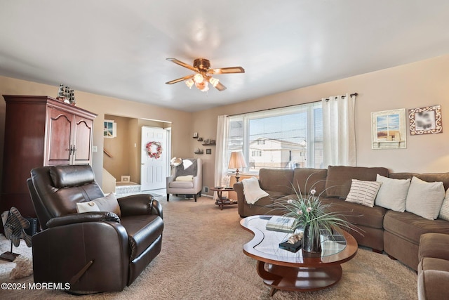 living room with light colored carpet and ceiling fan