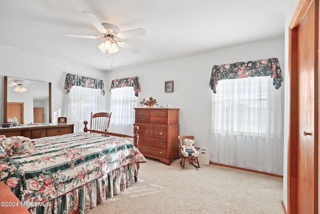 bedroom with light colored carpet and ceiling fan