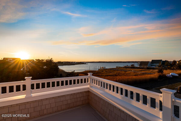 balcony at dusk with a water view