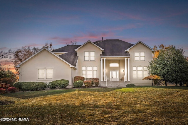 24 Clearwater Dr, Allentown, NJ 08501 - traditional-style home featuring stucco siding, a yard, and a shingled roof