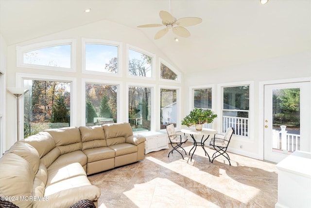 sunroom with ceiling fan and vaulted ceiling