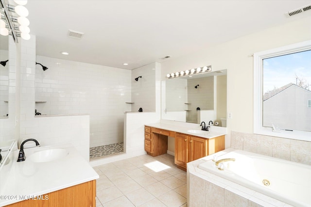 bathroom with independent shower and bath, vanity, and tile patterned flooring