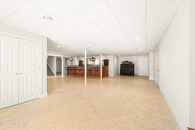 basement featuring a paneled ceiling